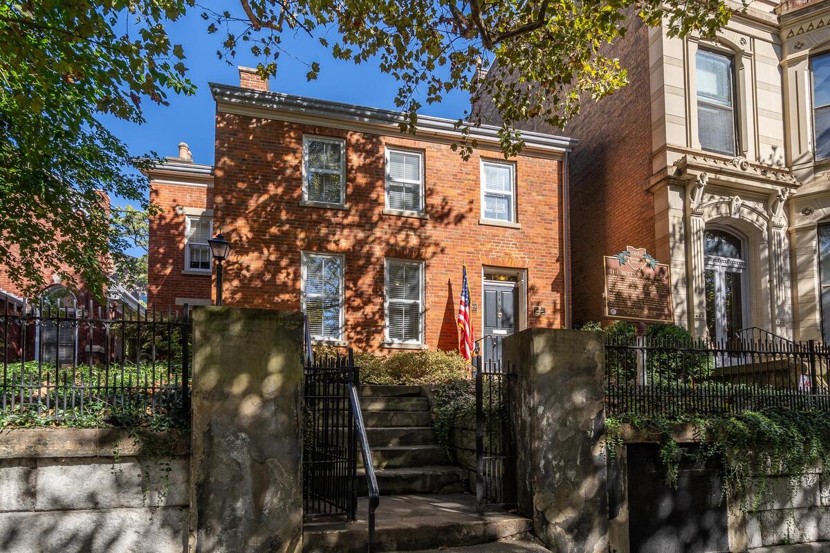 an exterior view of a historical brick home